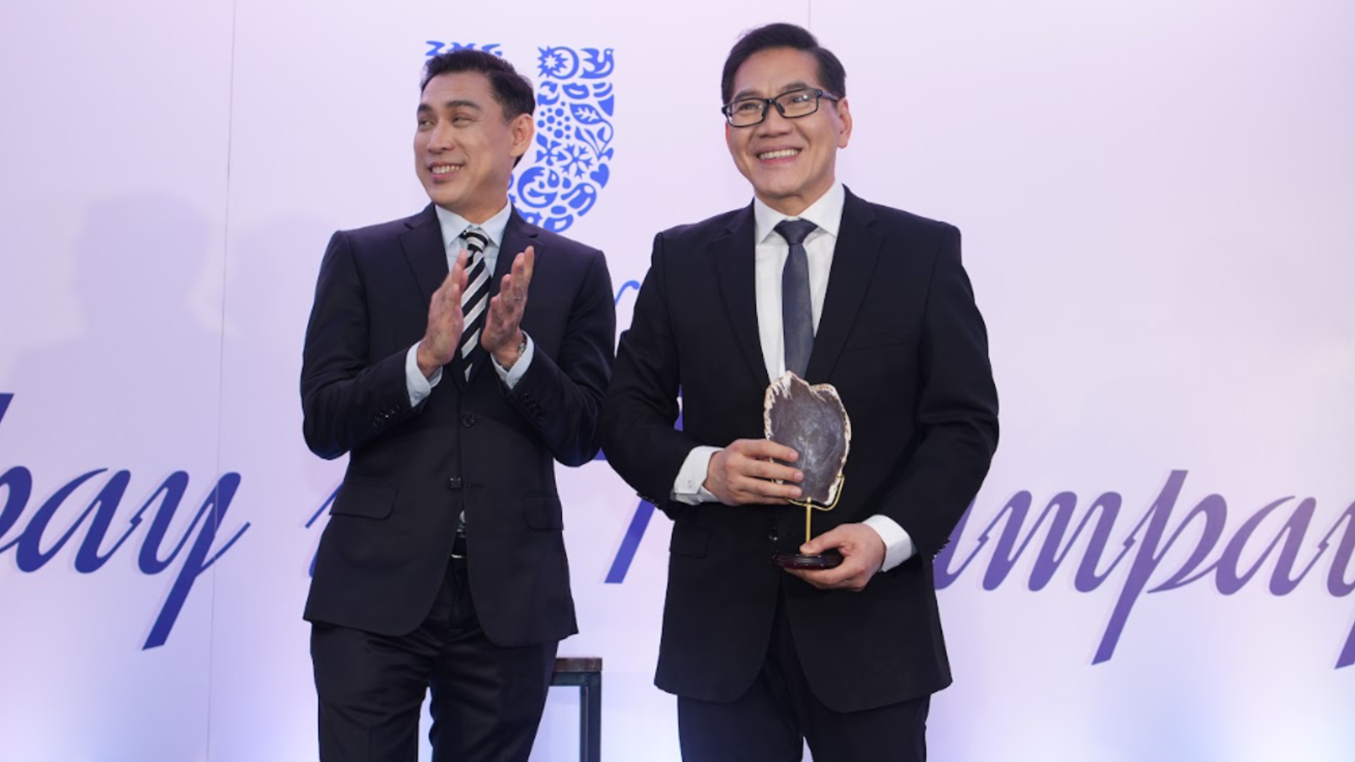 Unilever Philippines' homegrown talent Benjie Yap, left, and Fredy Ong, right