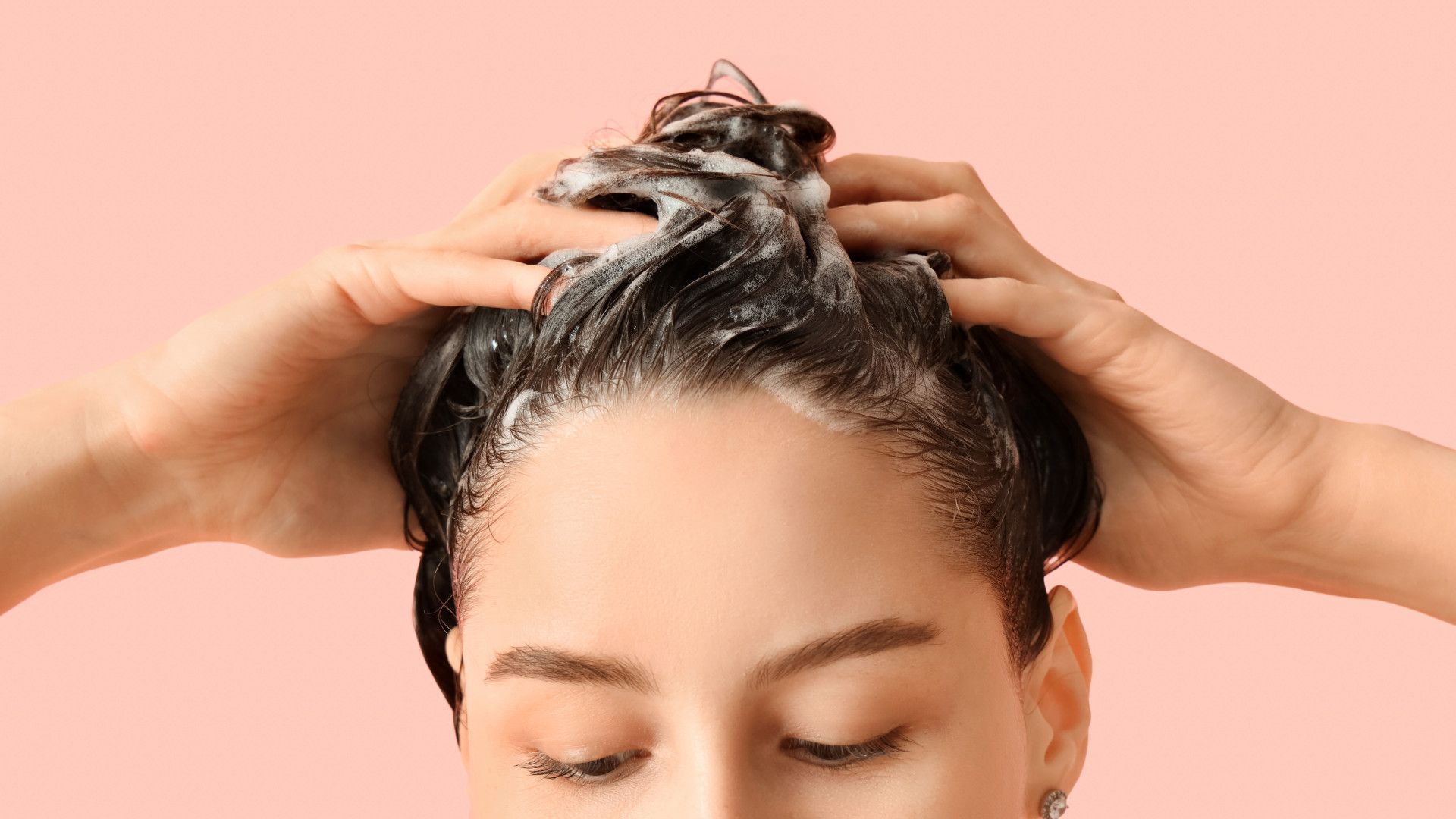 A woman washing her hair.