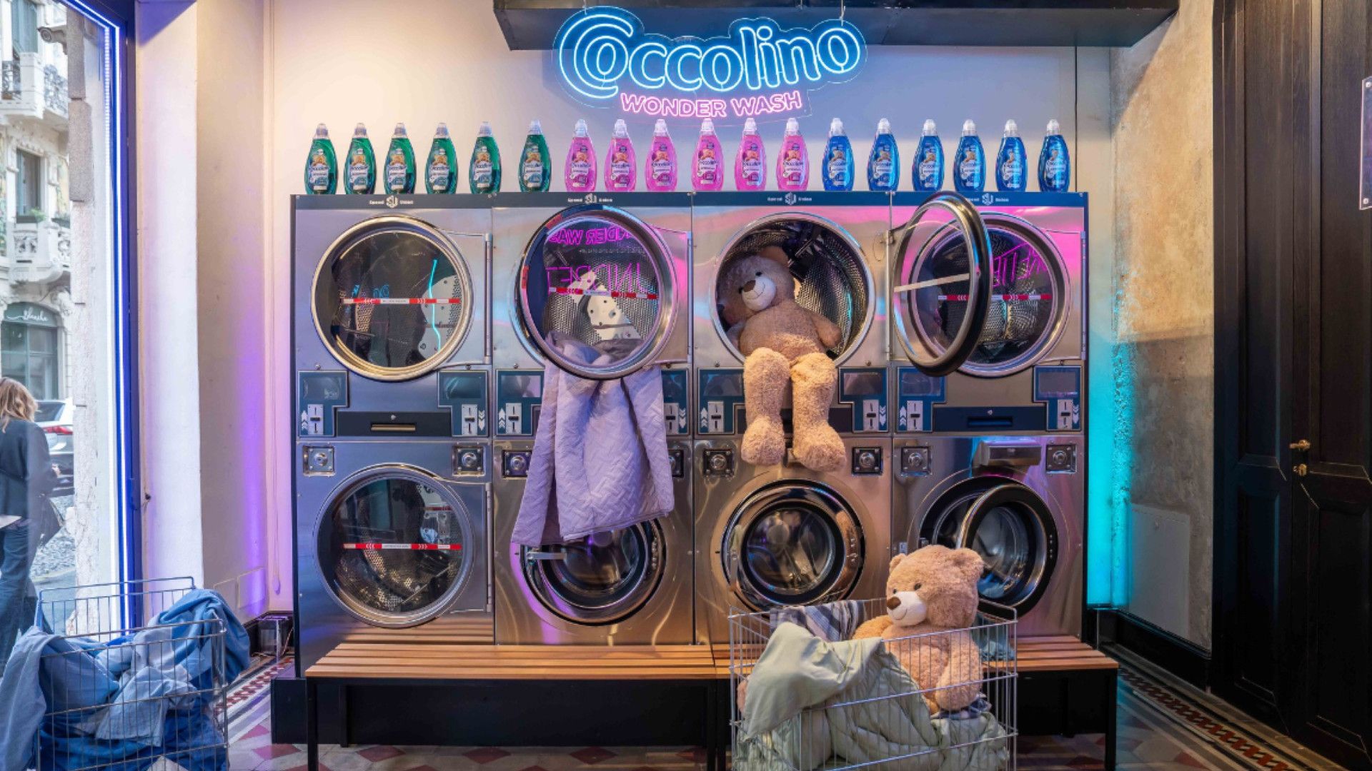 Coccolino Wonder Wash laundrette. 8 washing machines and bottles of detergent placed on top.