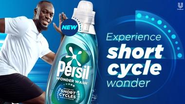 Advertising image of Usain Bolt and Persil Wonder Wash with text that reads ‘Experience short cycle wonder’.