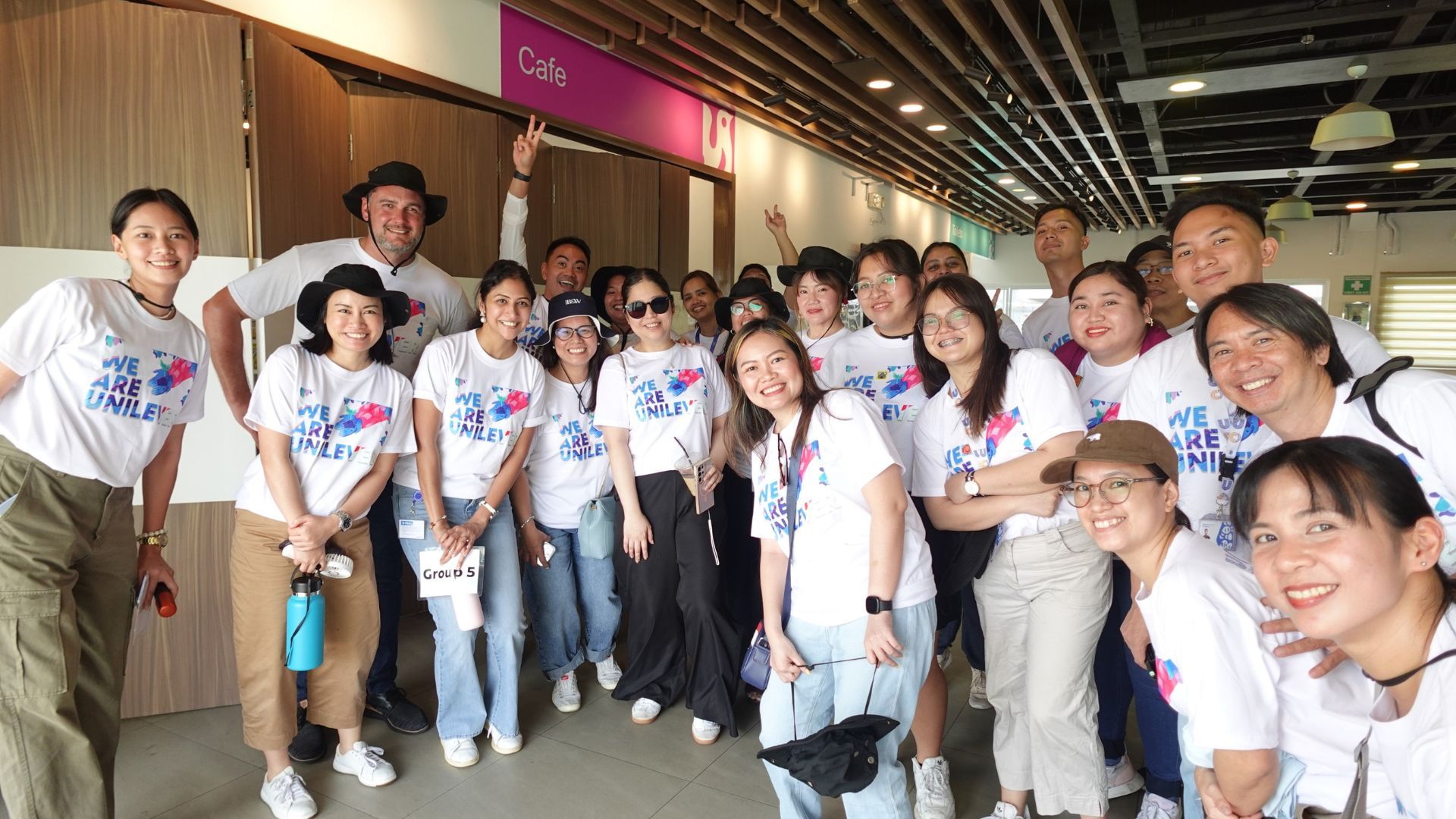 Group of employees gather for a group photo prior to tree planting activity