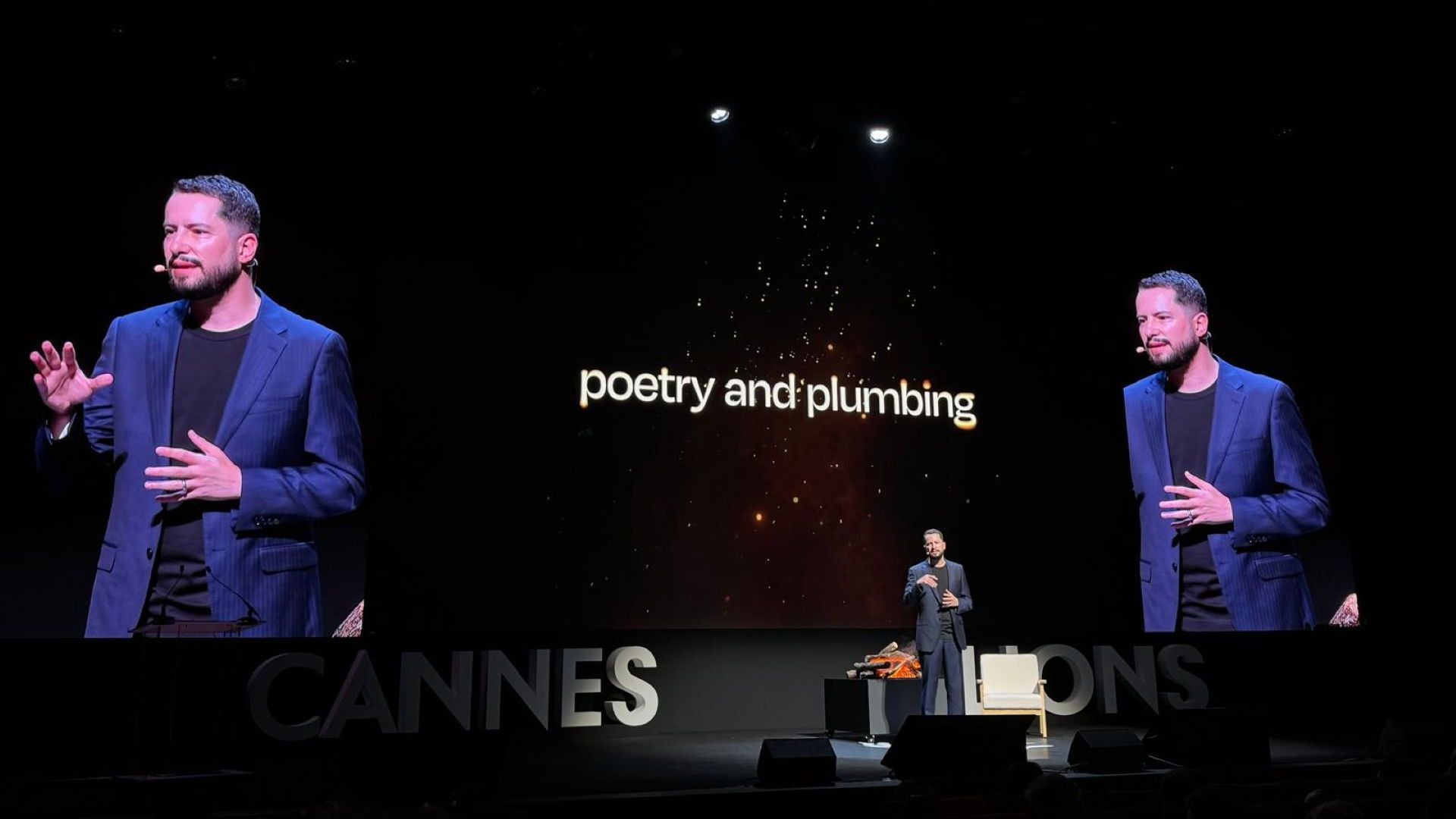 Leandro Barreto presenting on stage at Cannes Lions 2026, projector reads ‘poetry and plumbing’.