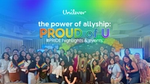 Group photo of Unilever employees celebrating Pride with rainbow flags and a balloon arch, featured under the banner “The Power of Allyship: Proud of U.”