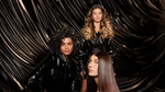 Three Tresemme models pose in front of a brown, silky back drop.