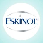Eskinol is written in blue, with a drop in place of the dot on letter i. A silver oval surrounds the word.